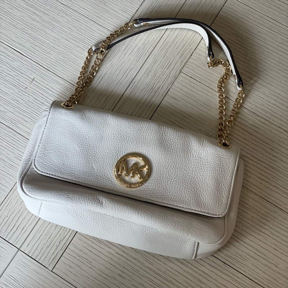 Michael Kors cream colored crossbody or shoulder bag with adjustable strap